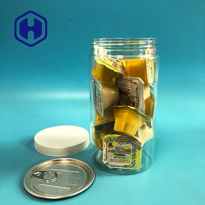 I chicchi di caffè delle mandorle del cereale di schiocco colano il barattolo di plastica della prova con il coperchio a vite